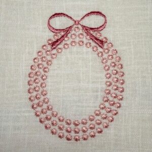 Stickdatei Perlenrahmen mit Schleife – Bild 1
